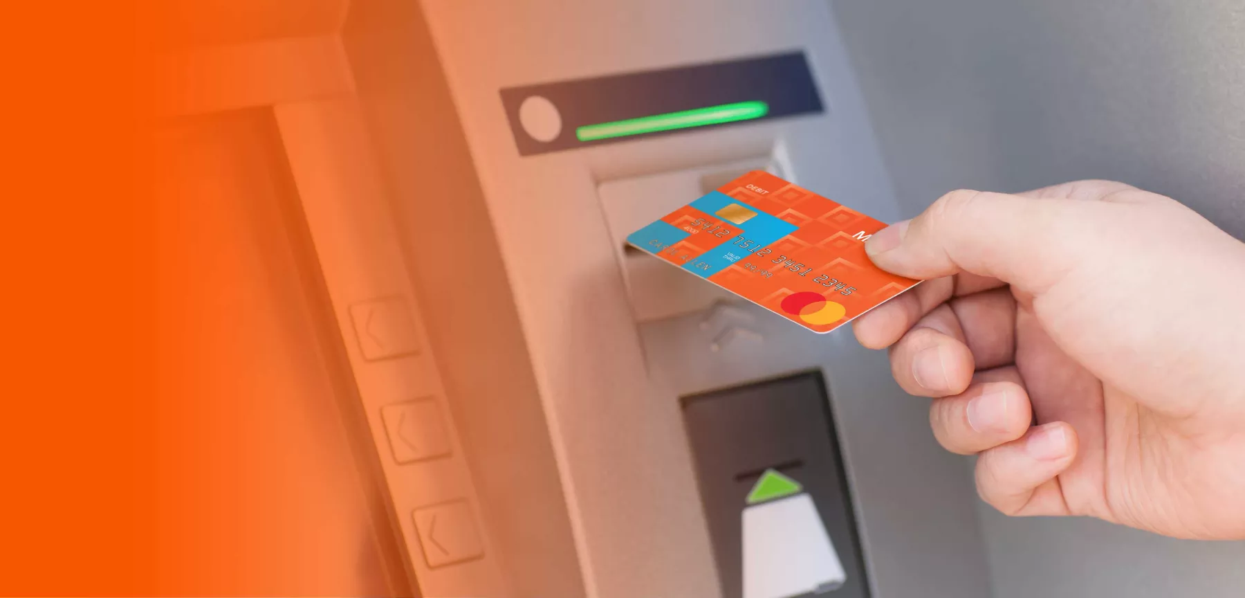 hand placing a midland card into the atm