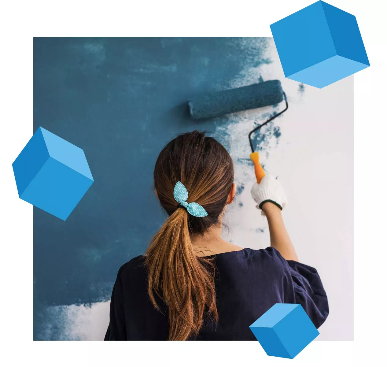 woman painting her home with blue cubes floating around her