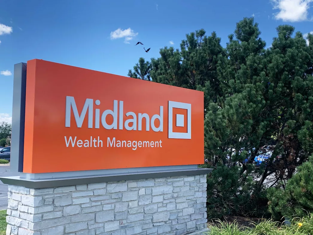 midland wealth management sign against blue sky